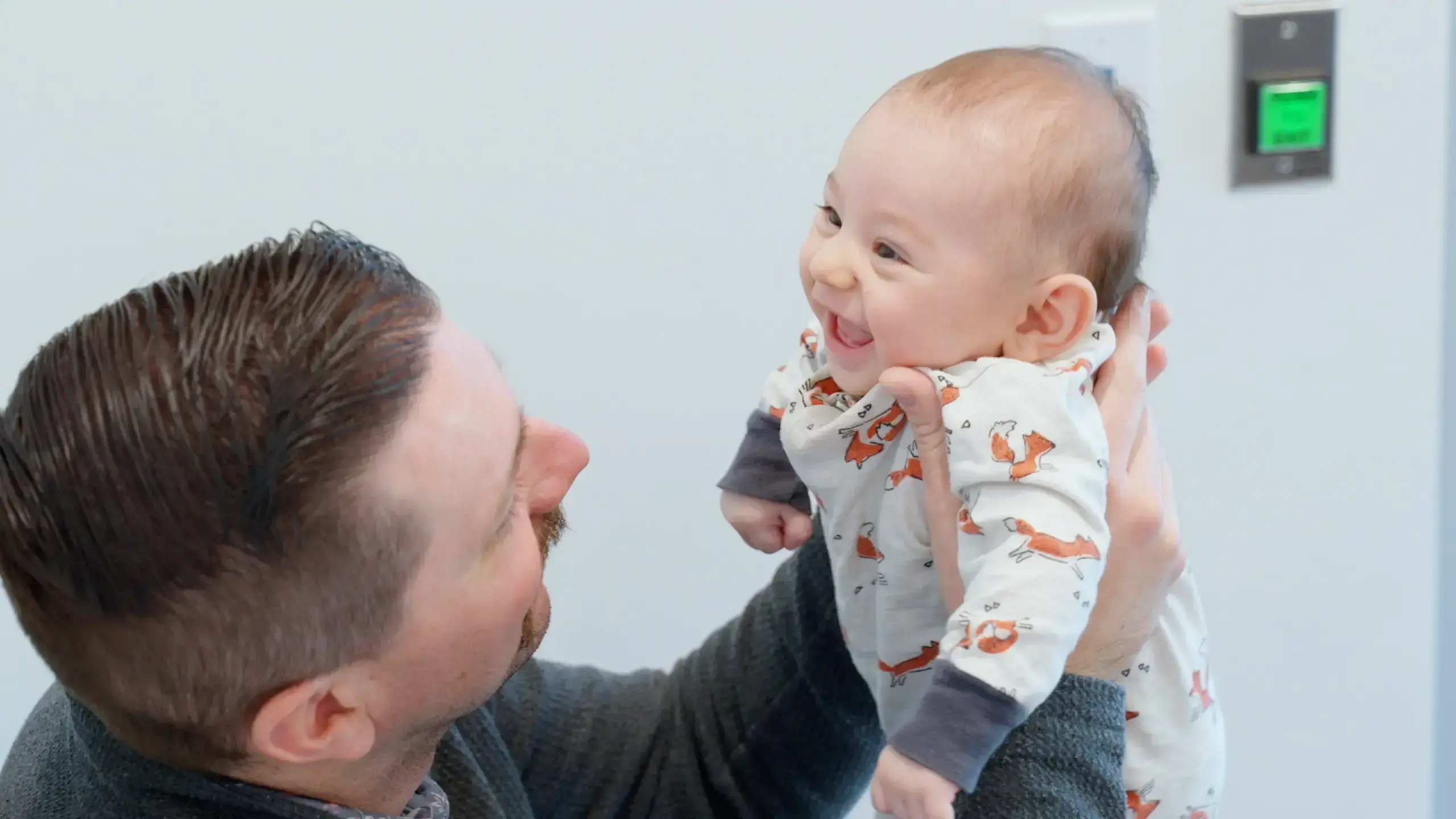 The couple’s baby with his dad.