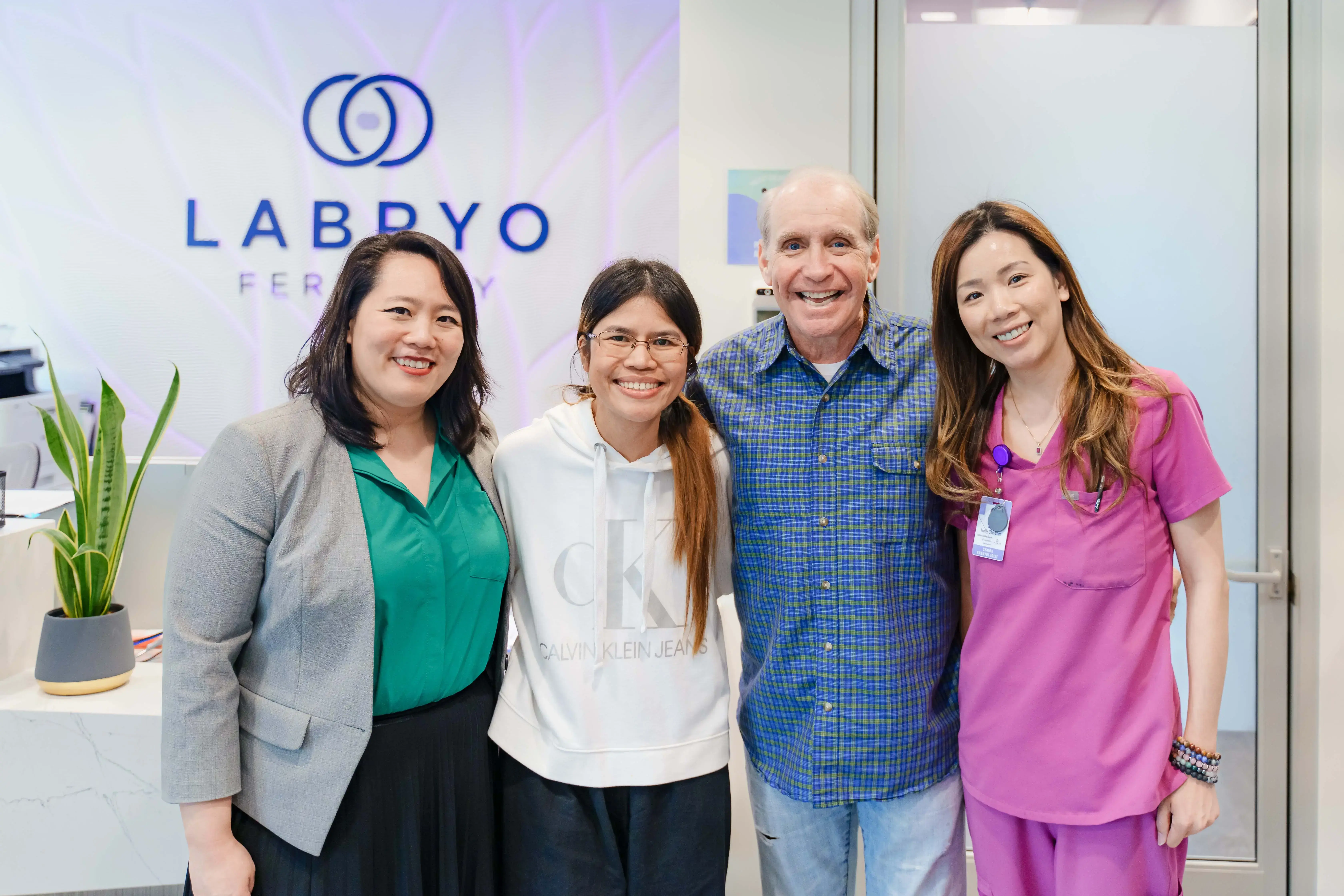 Couple with Molly, the embryologist, and Christina, the coordinator.